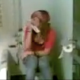 A pretty Spanish girl is seen peeing on a toilet.